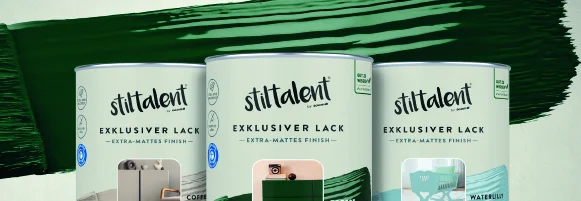 Drei Farbdosen in verschiedenen Farben