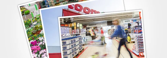 Person mit Einkaufswagen in einem Baumarkt