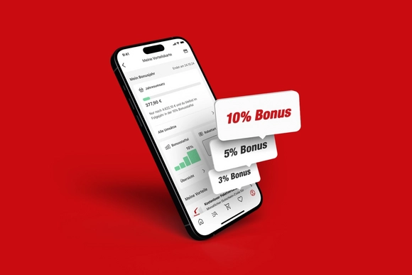 Smartphone mit Bonusprogramm auf rotem Hintergrund