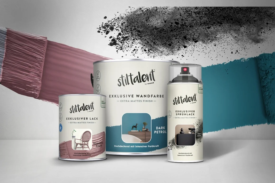 Drei Farbdosen in Rosa, Schwarz und Petrol