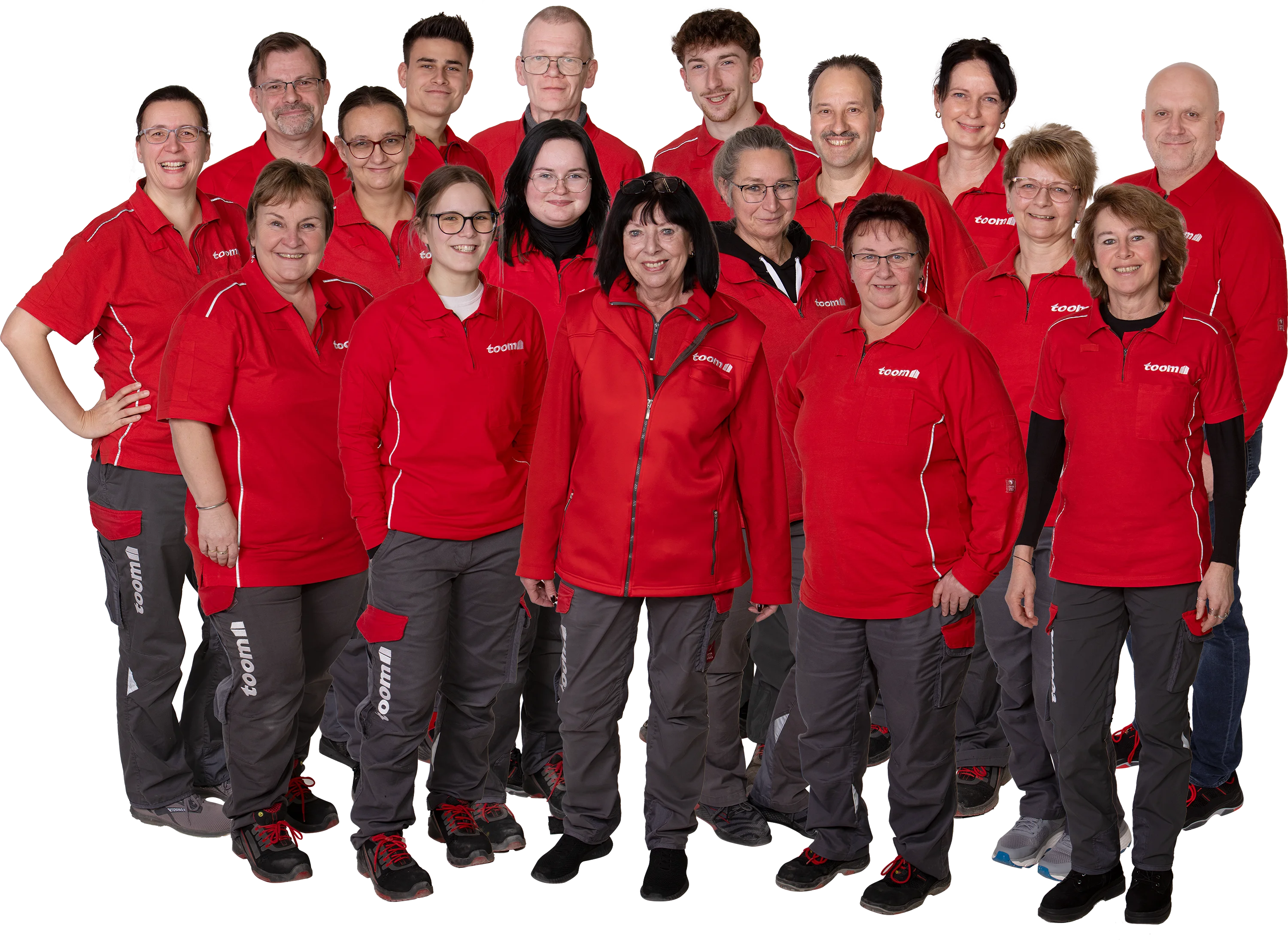 Gruppenfoto eines Teams in roter Arbeitskleidung.