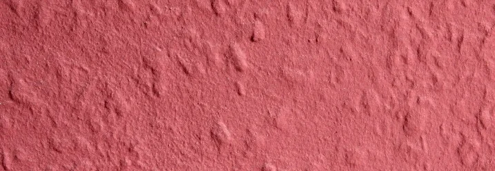 Rosafarbene raue Wandstruktur