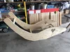 Zwei selbstgebaute Schaukelliegen aus Holz mit Herzausschnitt in einer Werkstatt.