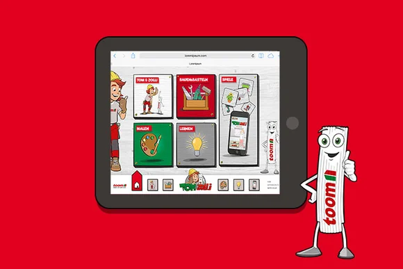 Tablet mit Webseite von toom und Comicfigur Zolli