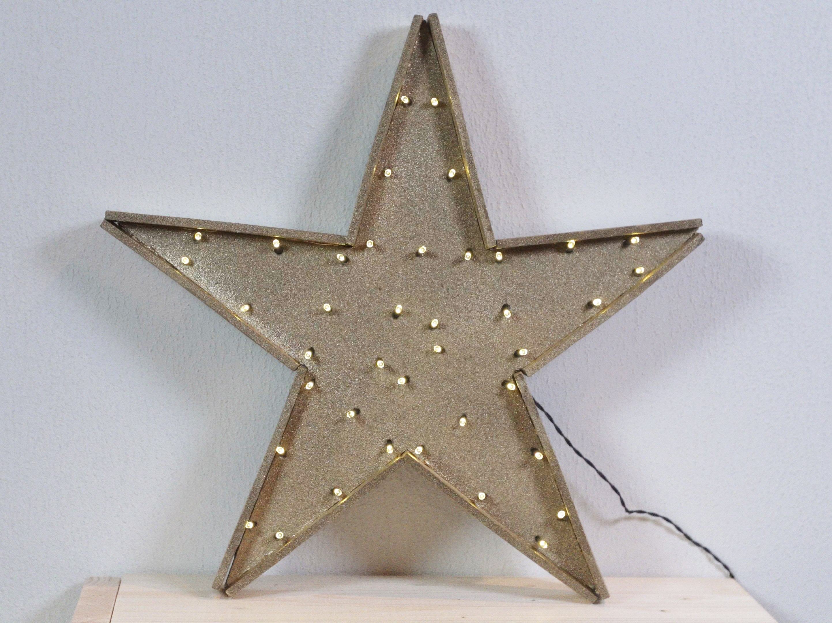 Leuchtender goldener Stern