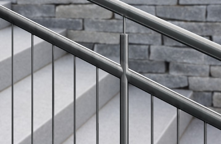 Edelstahlgeländer an Granittreppe mit unscharfem Hintergrund